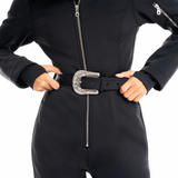 Black western belt with engraved buckle worn on the Mae ski suit